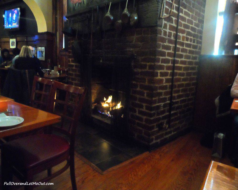 Dining by a crackling fire.